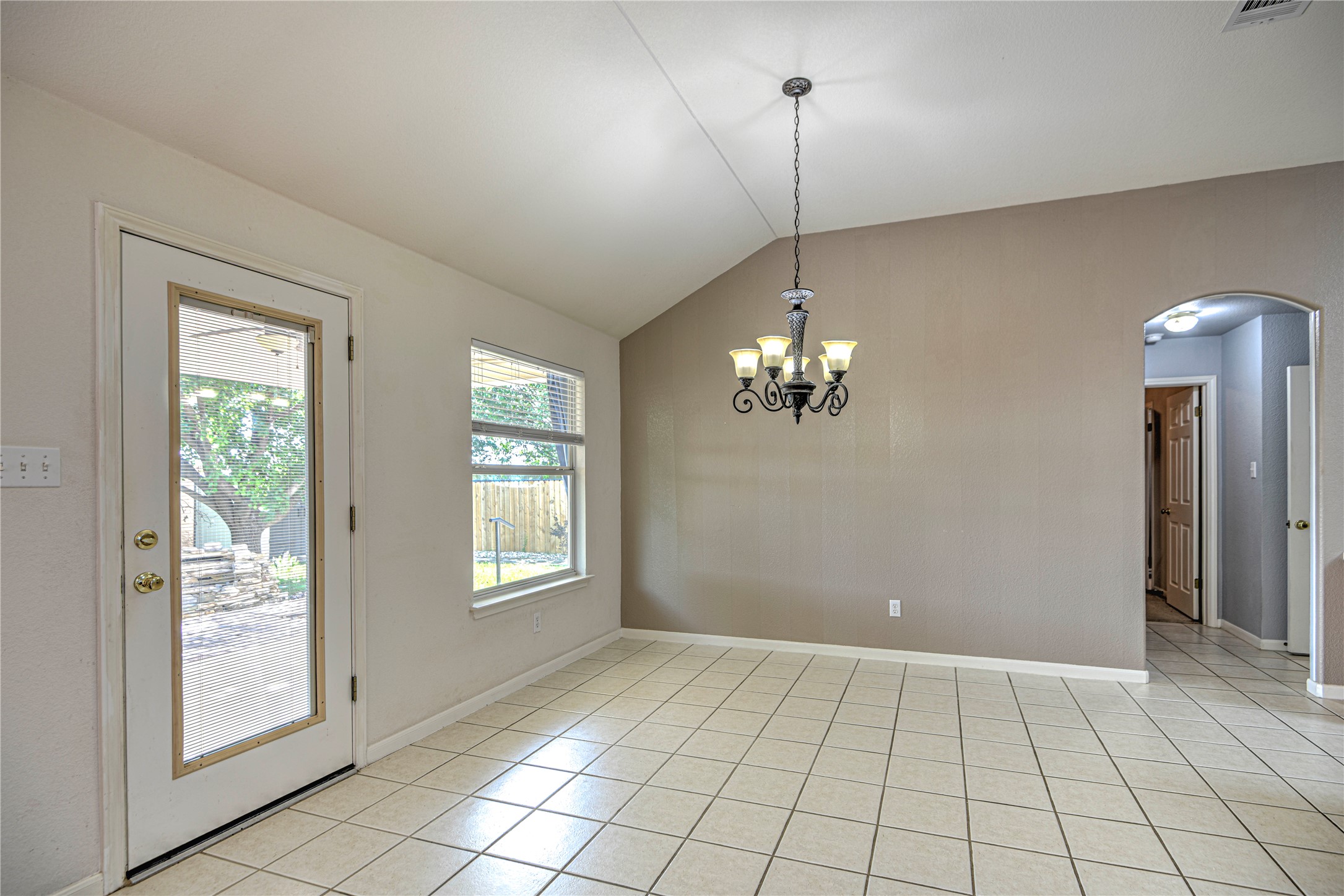1900 Rutherford Drive Leander, TX 78641 - Photo 15 of 38 a view of an empty room with window and chandelier fan
