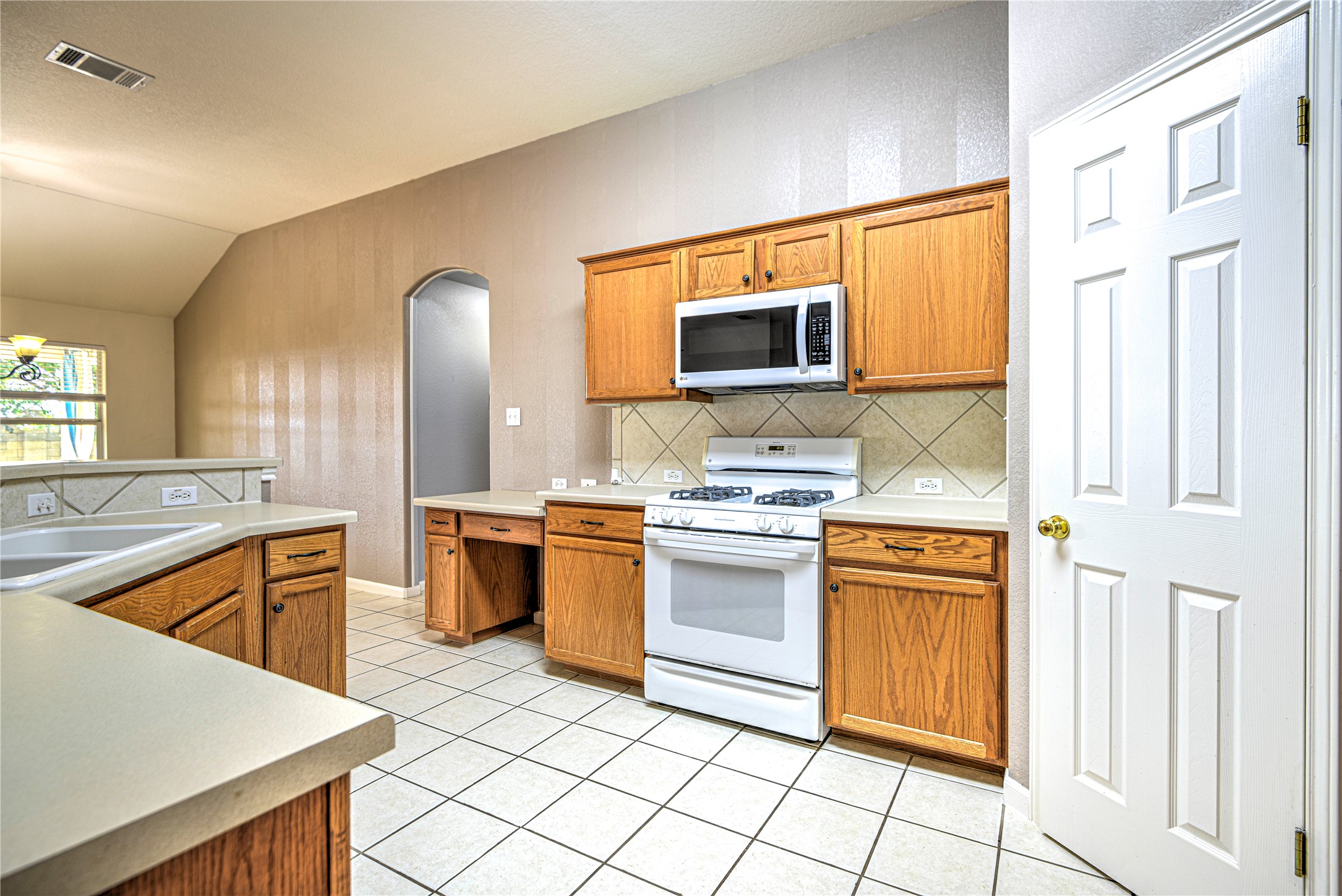 1900 Rutherford Drive Leander, TX 78641 - Photo 20 of 38 a kitchen with stainless steel appliances granite countertop a sink and a stove top oven