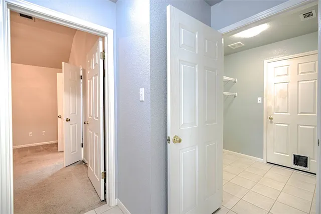 a view of a bathroom with a shower and a sink