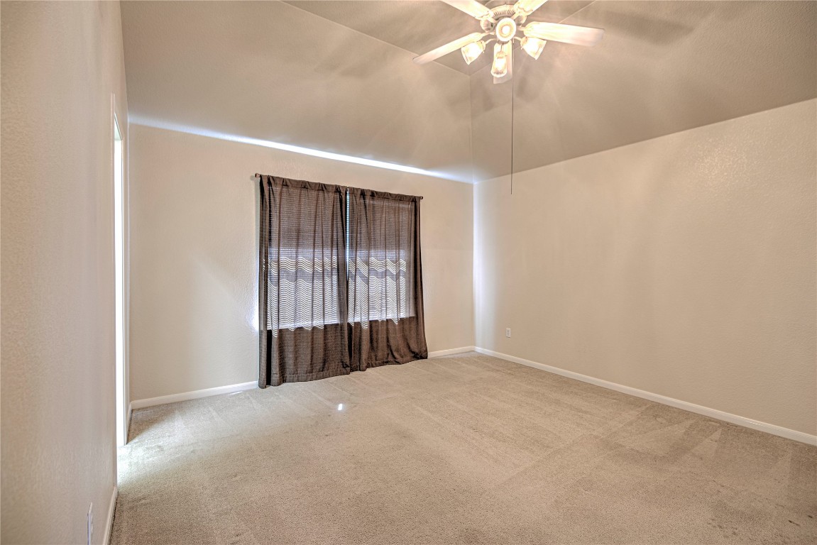 1900 Rutherford Drive Leander, TX 78641 - Photo 23 of 38 a view of a livingroom with a chandelier fan and window
