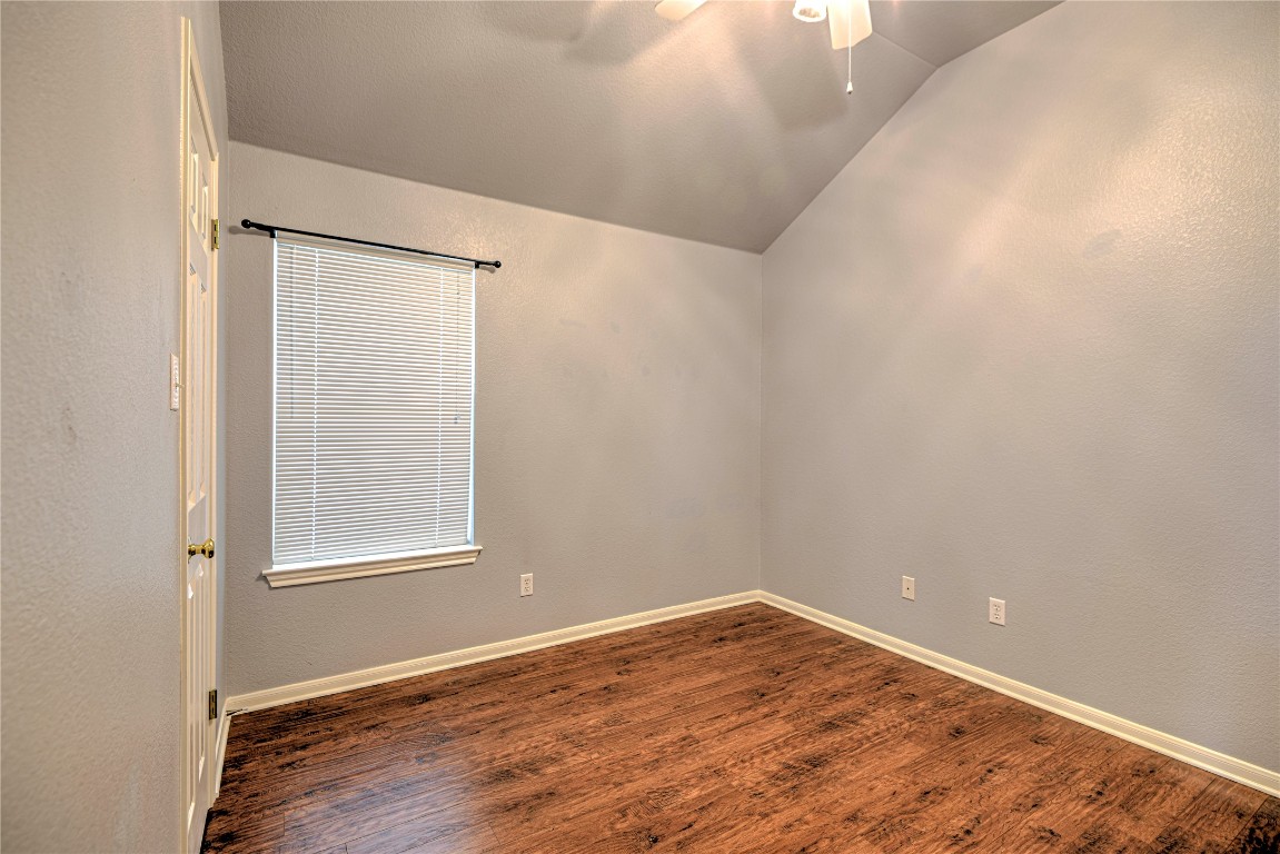 1900 Rutherford Drive Leander, TX 78641 - Photo 27 of 38 an empty room with wooden floor and windows