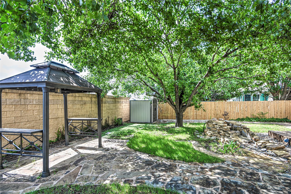 1900 Rutherford Drive Leander, TX 78641 - Photo 32 of 38 a front view of a house with garden