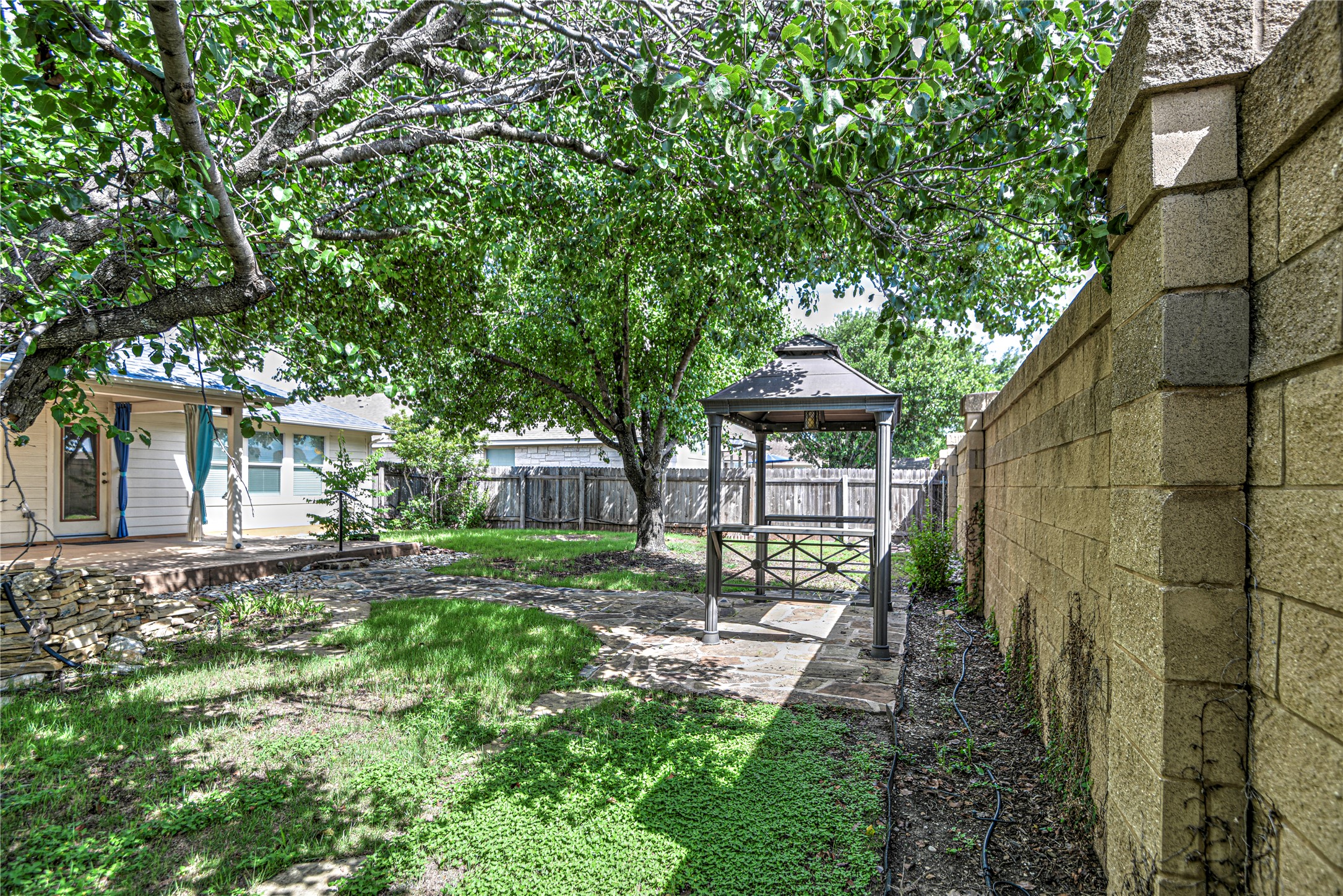 1900 Rutherford Drive Leander, TX 78641 - Photo 34 of 38 a front view of a house with a yard