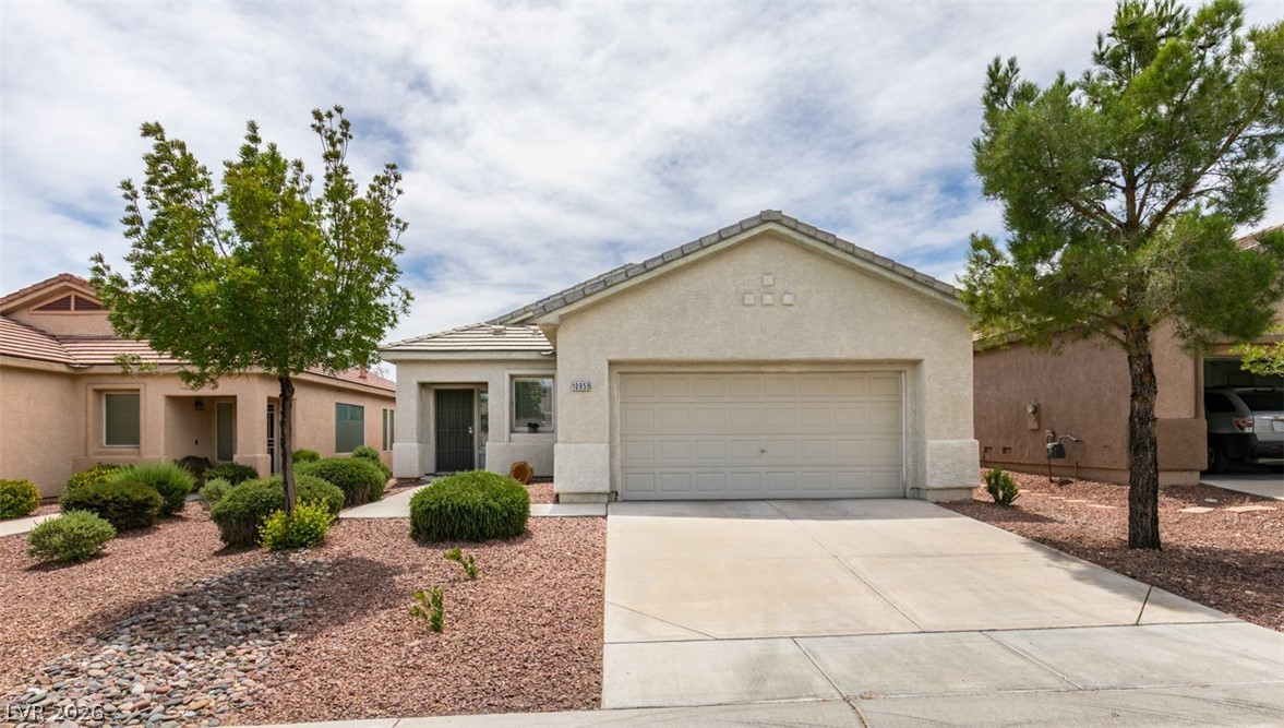 10959 Pumpkin Ridge Avenue Las Vegas, NV 89135 - Photo 37 of 51 Discover your charming single-story home featuring a low-maintenance xeriscape front yard and an attached garage at 10959 Pumpkin Ridge Ave LV NV 89135
