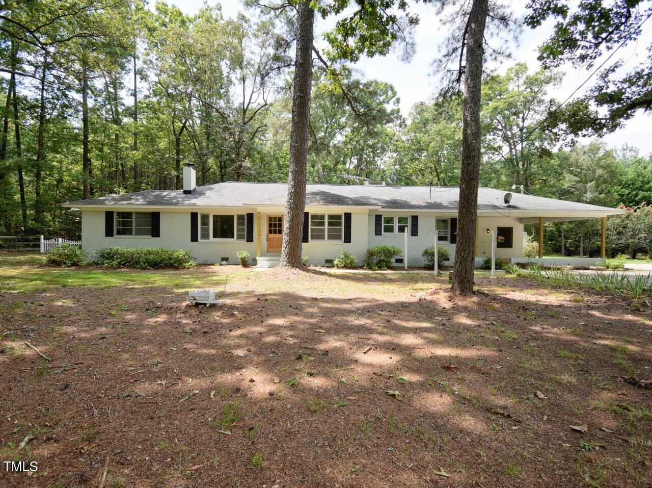 906 Perry Road Zebulon, NC 27597 - Photo 1 of 36 a front view of a house with a yard and green space