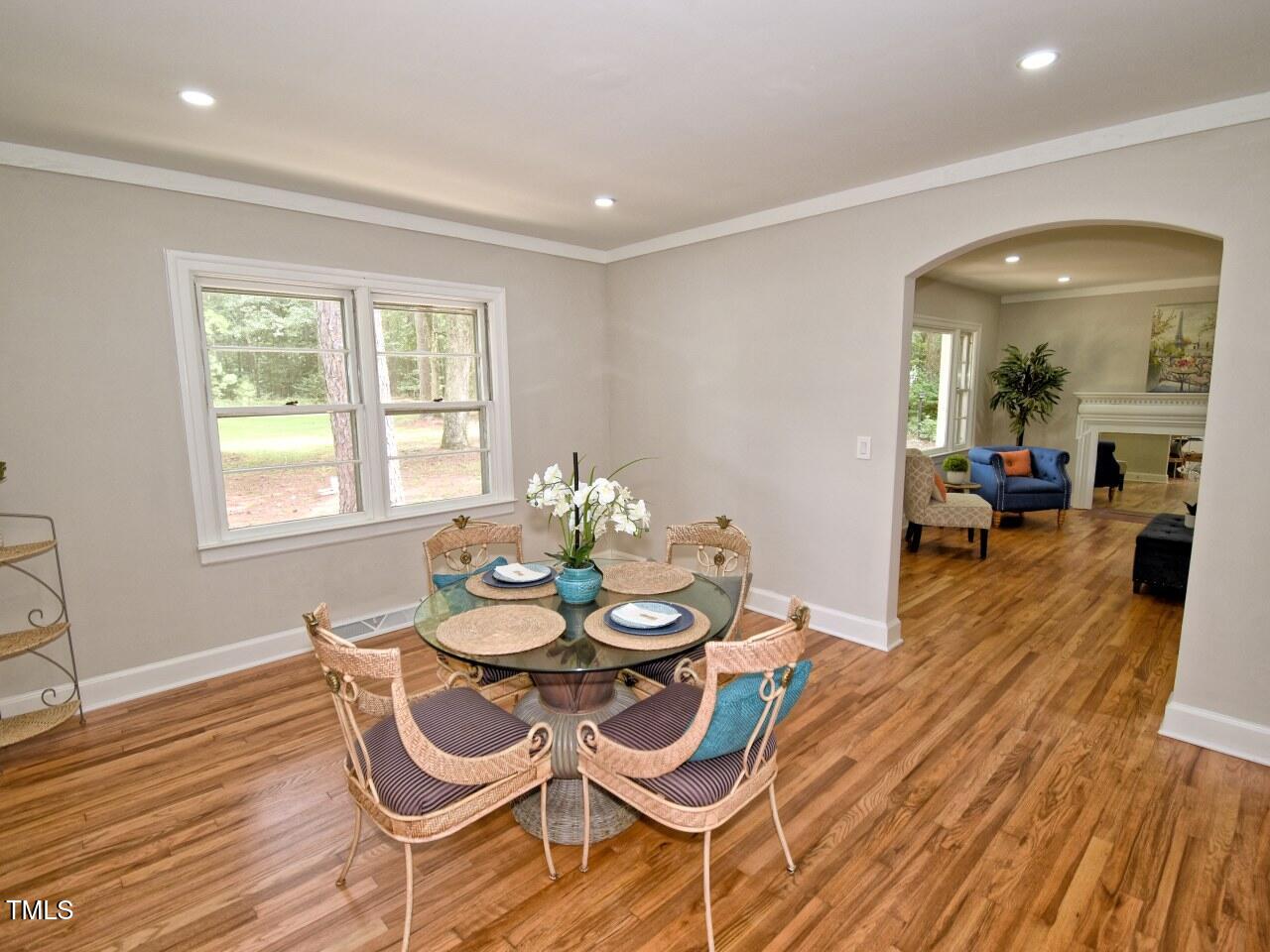 906 Perry Road Zebulon, NC 27597 - Photo 11 of 36 a dining room with furniture and wooden floor
