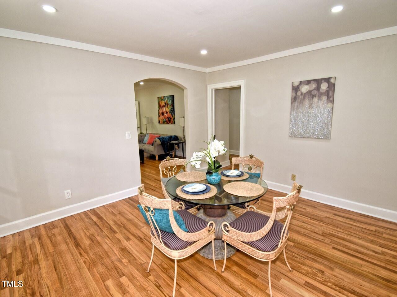 906 Perry Road Zebulon, NC 27597 - Photo 12 of 36 a dining room with furniture and wooden floor