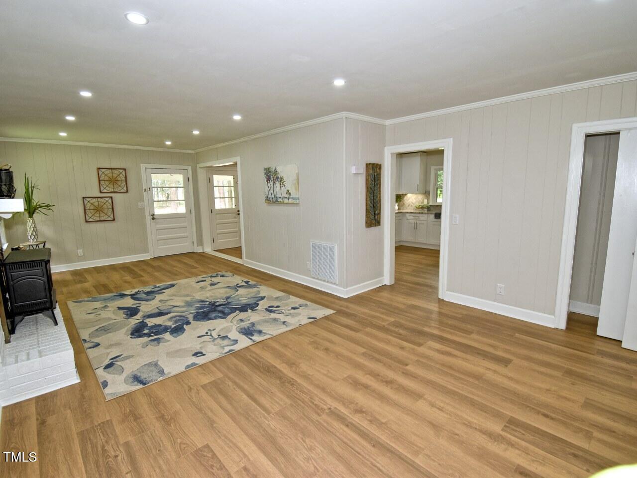 906 Perry Road Zebulon, NC 27597 - Photo 14 of 36 a view of a livingroom with wooden floor