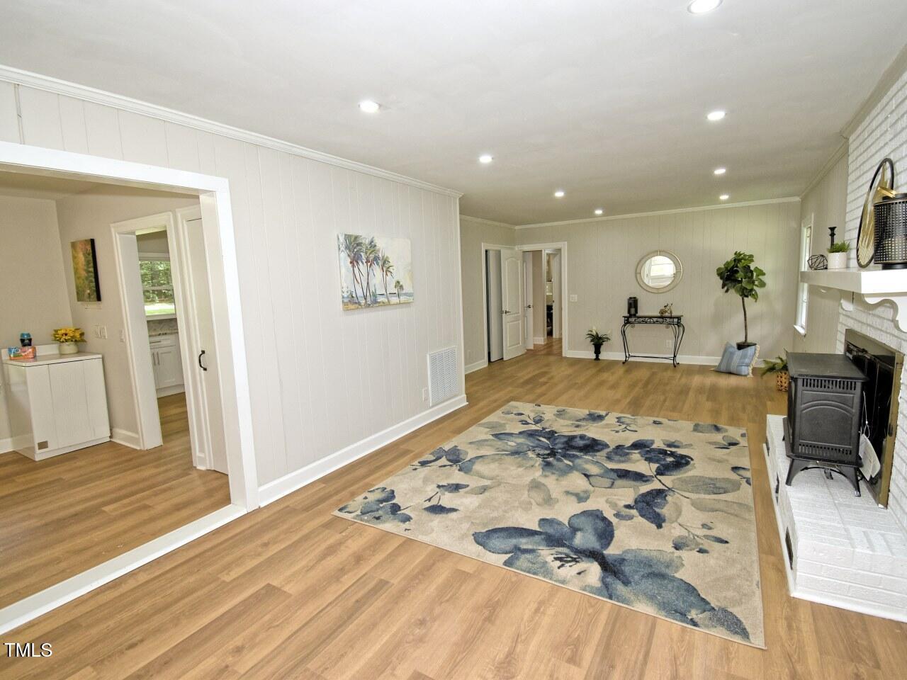 906 Perry Road Zebulon, NC 27597 - Photo 17 of 36 a view of a bedroom with wooden floor and bedroom view