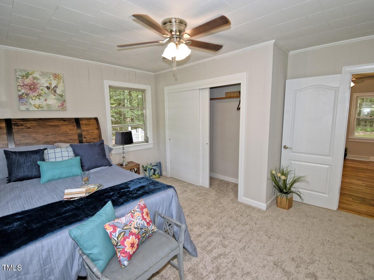 906 Perry Road Zebulon, NC 27597 - Photo 20 of 36 a living room with furniture and a potted plant