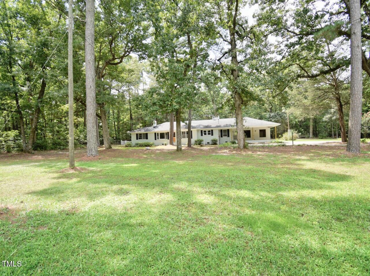 906 Perry Road Zebulon, NC 27597 - Photo 2 of 36 a view of house with outdoor space