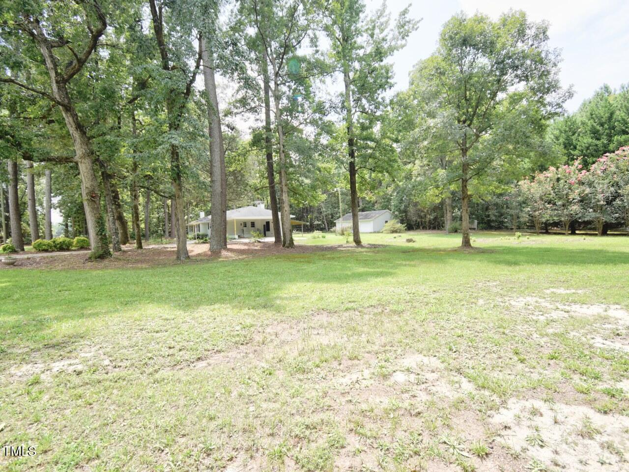906 Perry Road Zebulon, NC 27597 - Photo 29 of 36 a view of a tree in a park