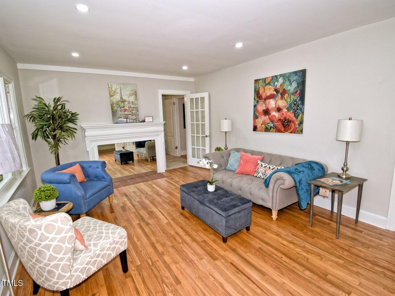 906 Perry Road Zebulon, NC 27597 - Photo 3 of 36 a living room with furniture and a fireplace