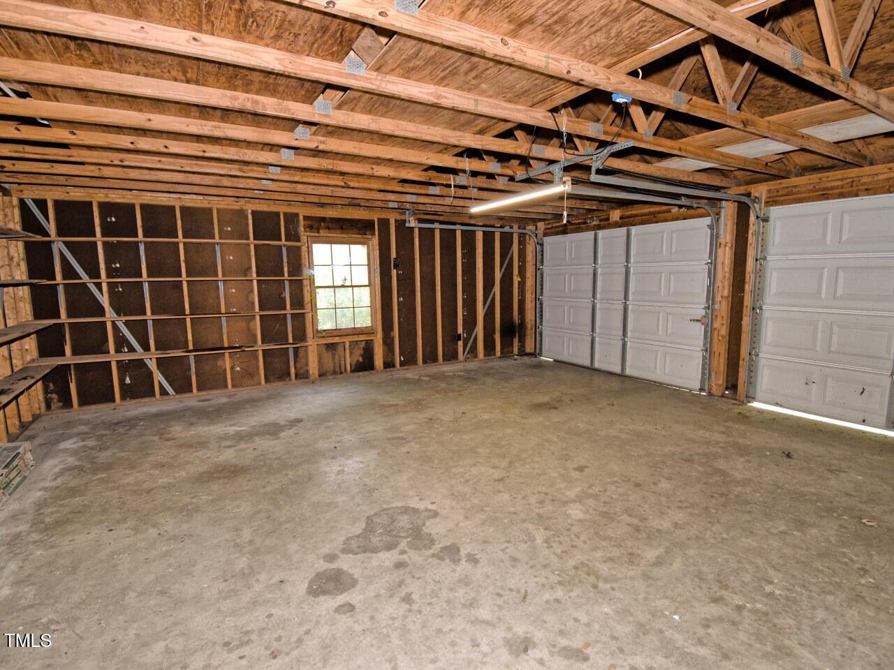 906 Perry Road Zebulon, NC 27597 - Photo 34 of 36 a view of an empty room with a window