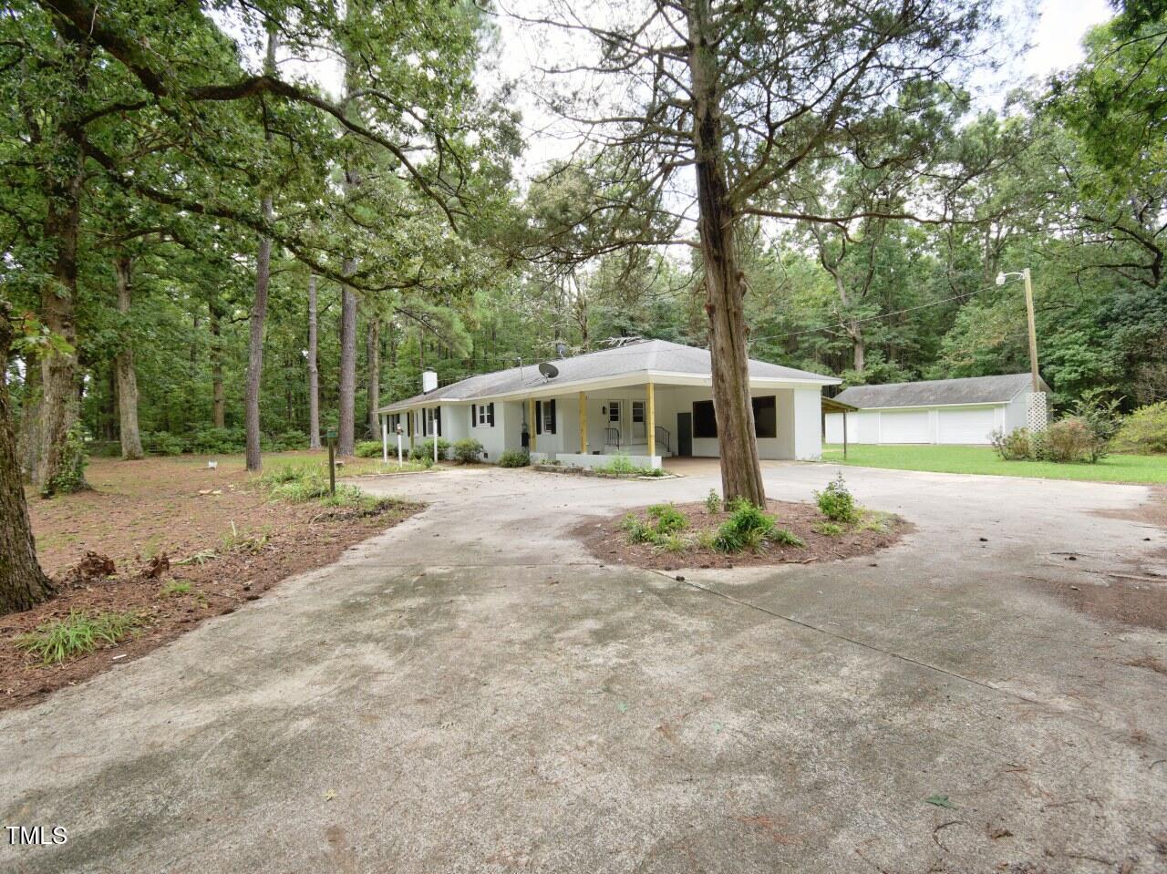 906 Perry Road Zebulon, NC 27597 - Photo 36 of 36 a front view of a house with garden