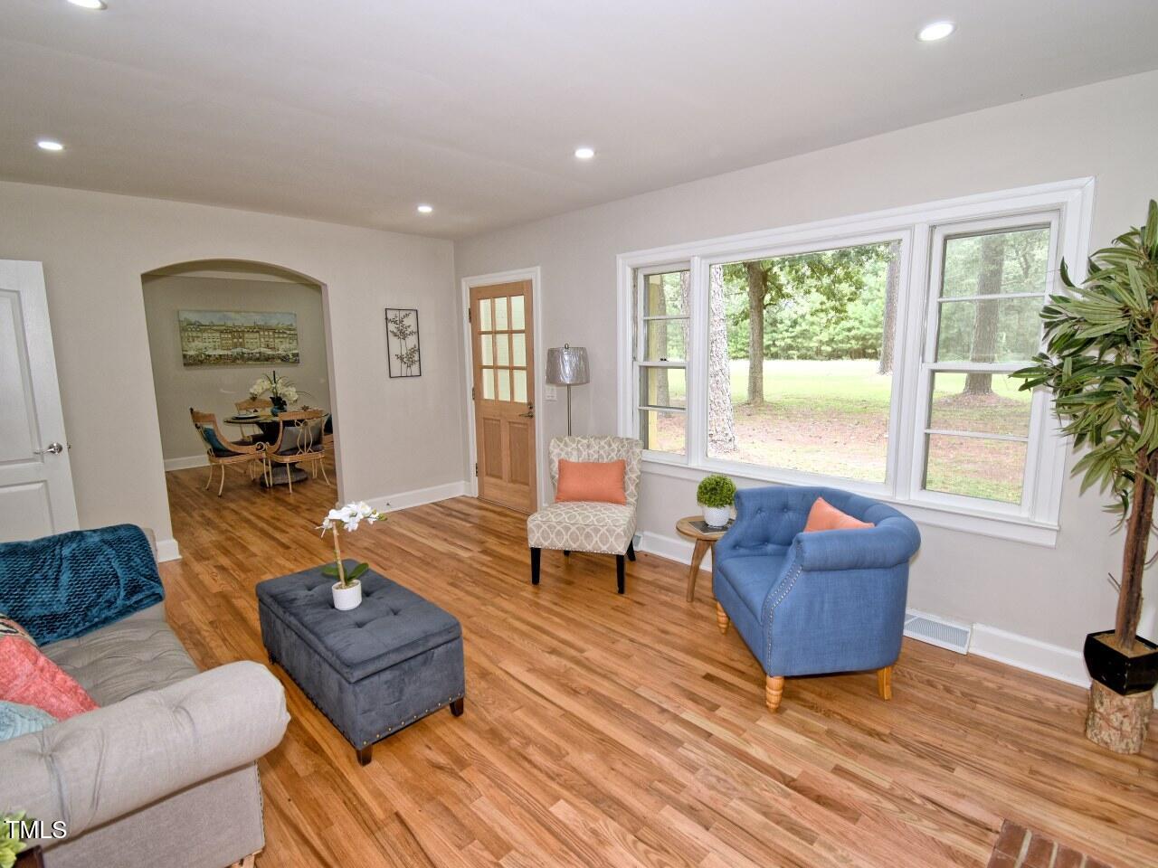 906 Perry Road Zebulon, NC 27597 - Photo 5 of 36 a living room with furniture and a window