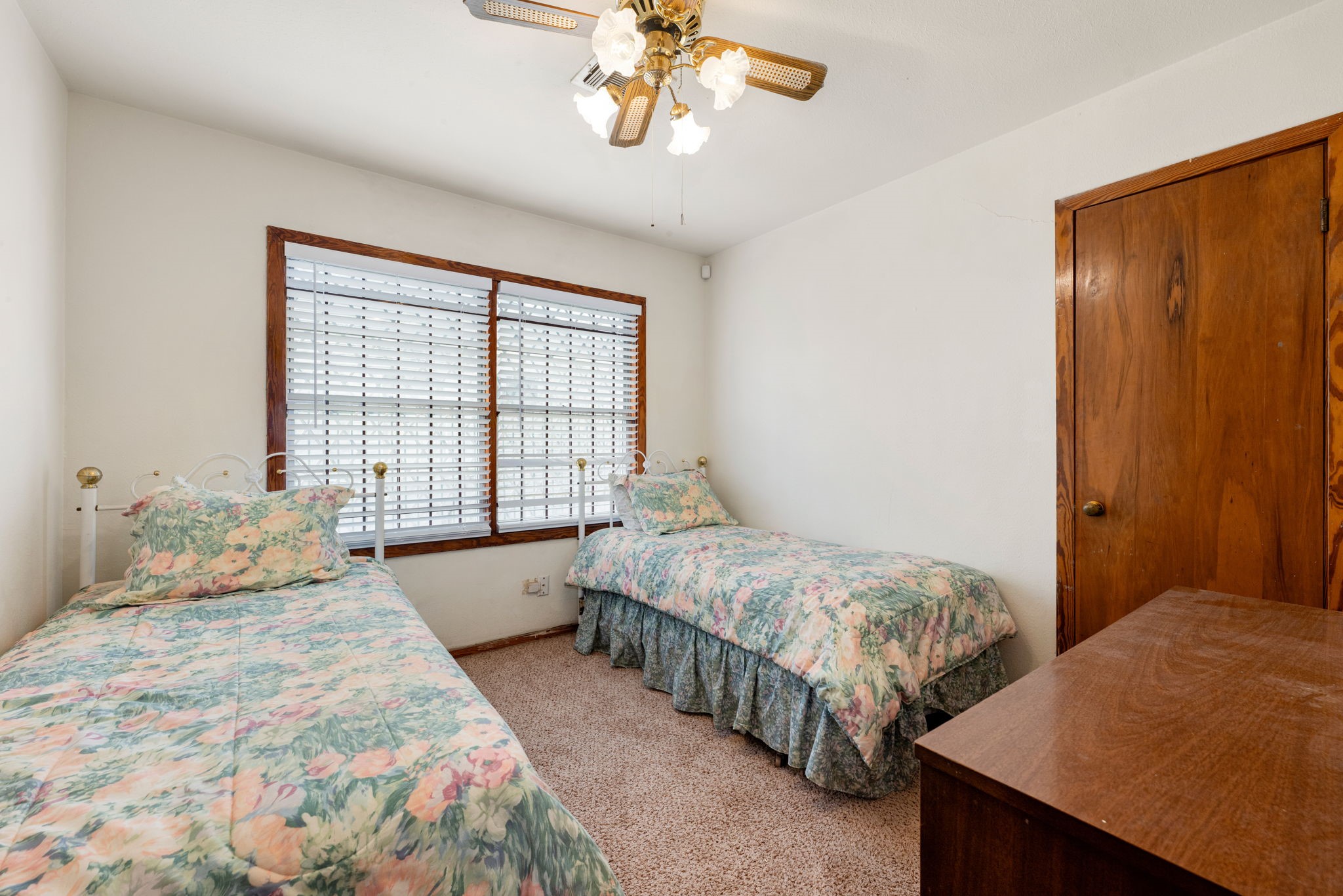 10923 Duane Street Houston, TX 77047 - Photo 13 of 22 a bedroom with two beds and a window