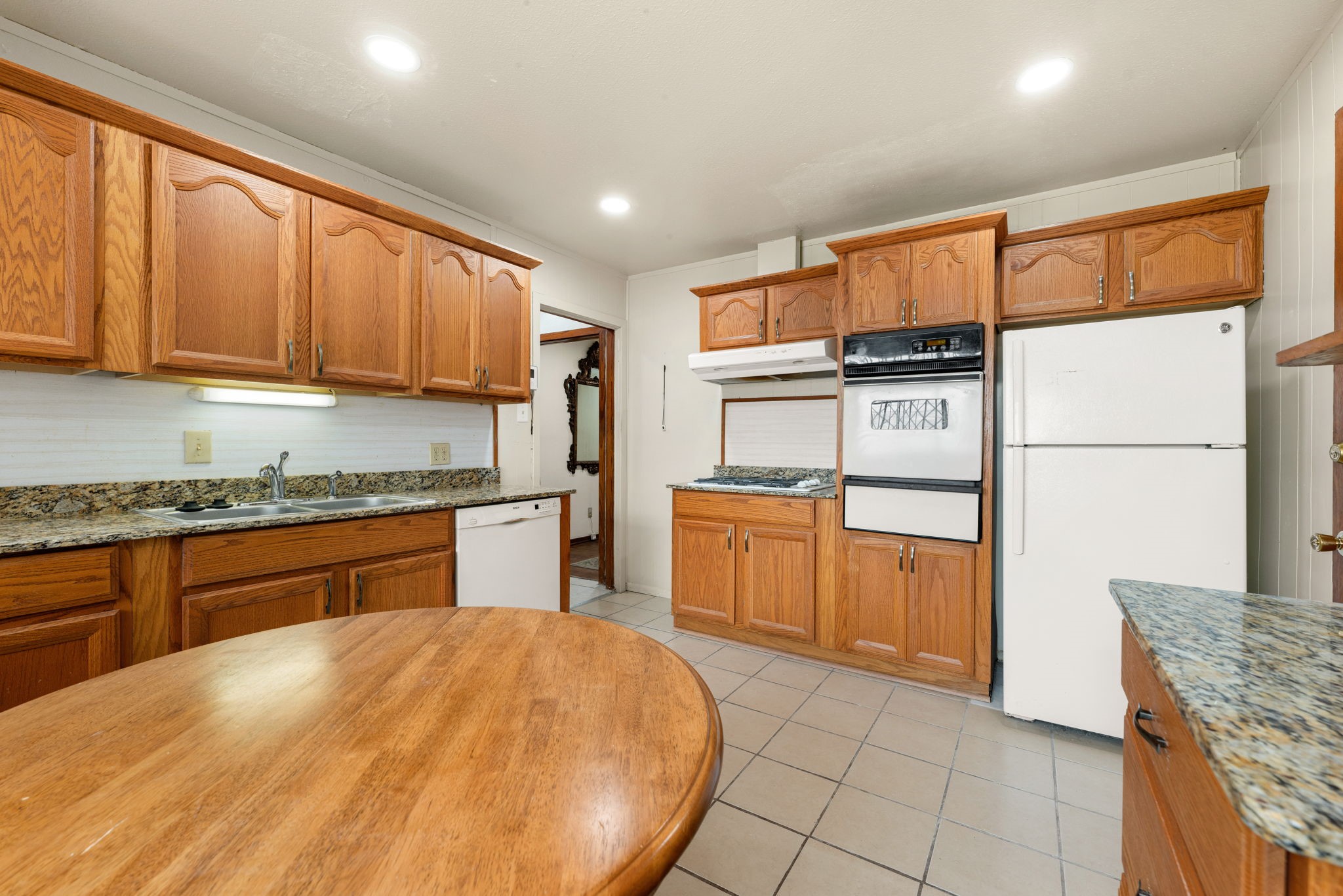 10923 Duane Street Houston, TX 77047 - Photo 16 of 22 a kitchen with stainless steel appliances granite countertop a stove a sink and a refrigerator