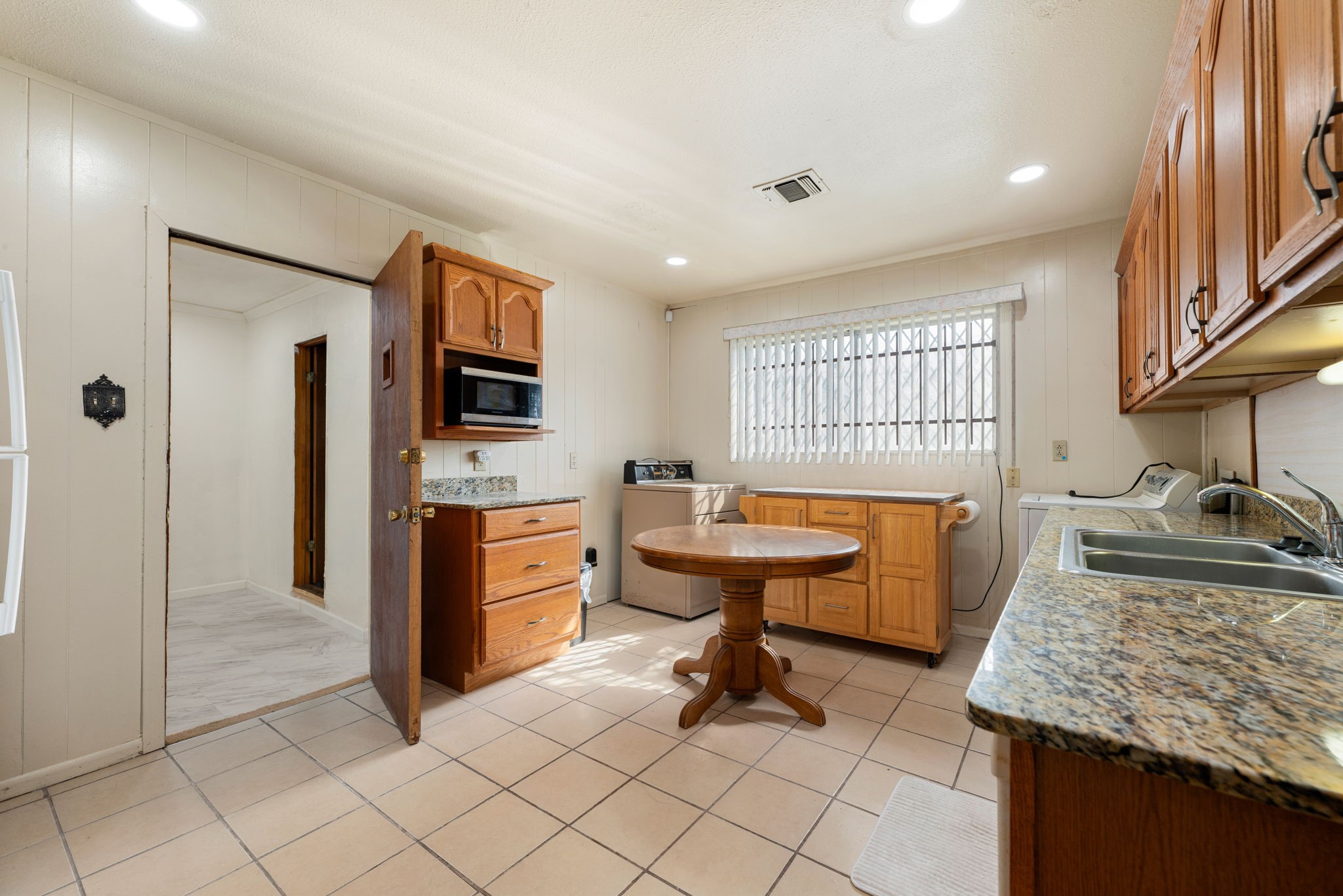10923 Duane Street Houston, TX 77047 - Photo 19 of 22 a kitchen with stainless steel appliances granite countertop a sink stove and refrigerator