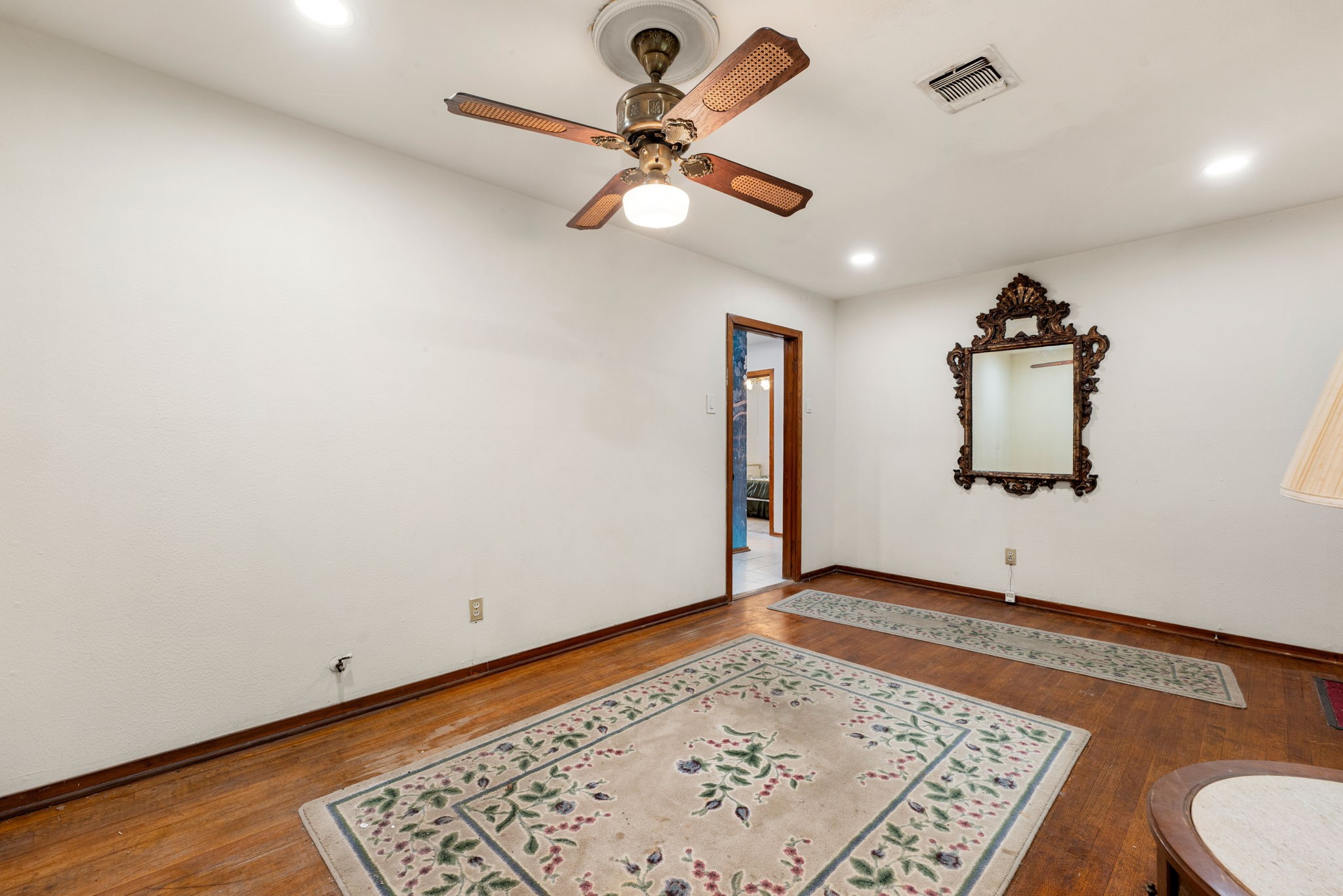 10923 Duane Street Houston, TX 77047 - Photo 9 of 22 an empty room with a window and a ceiling fan