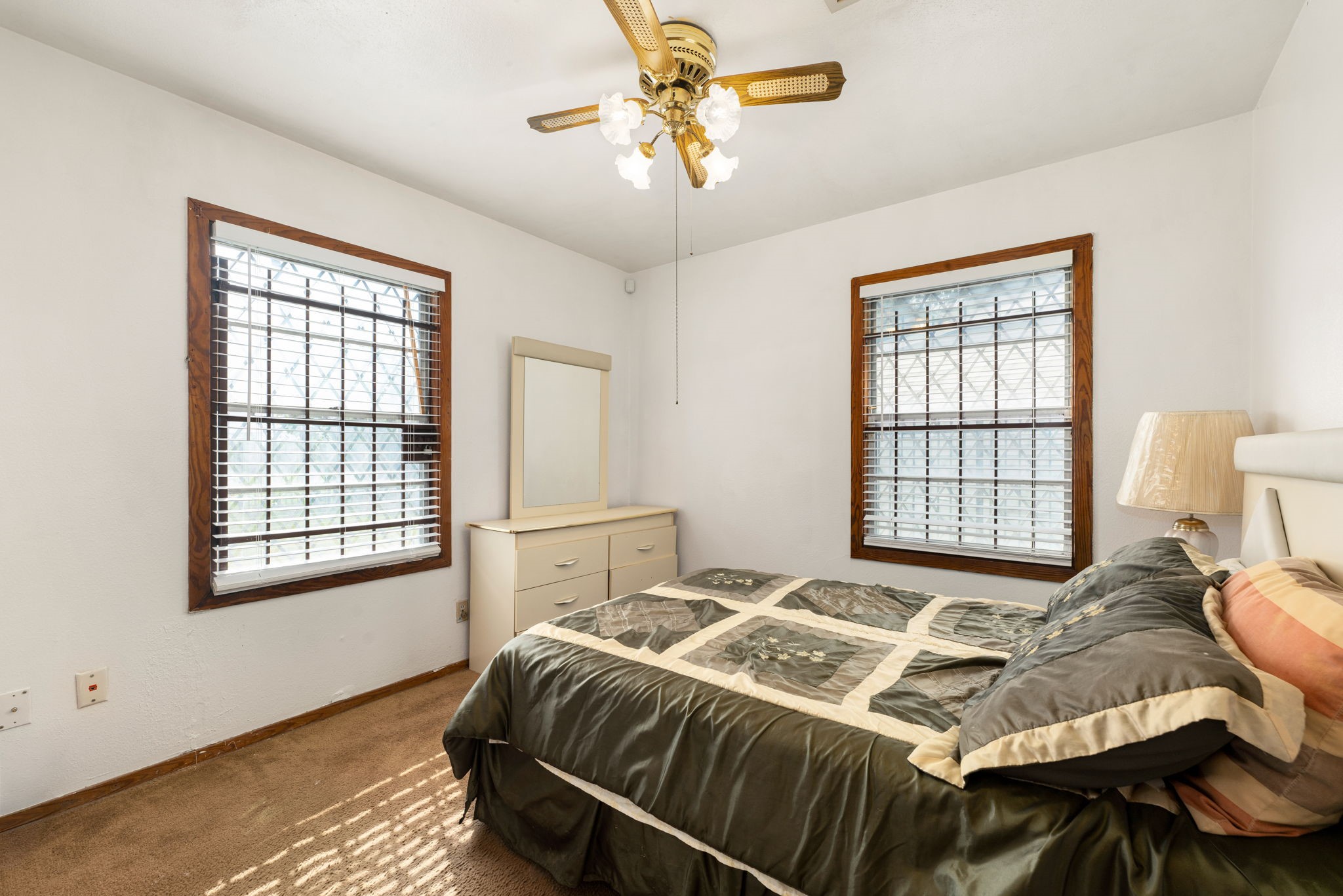 10923 Duane Street Houston, TX 77047 - Photo 10 of 22 a bedroom with a bed and a window