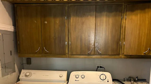 a kitchen with granite countertop a sink and a stove