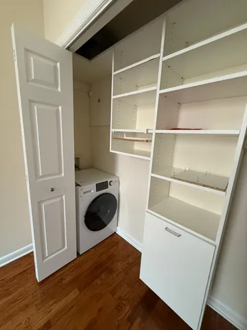 a bathroom with a sink vanity mirror and toilet