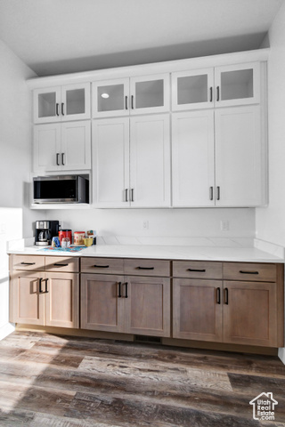 1952 Highway 118 Monroe, UT 84754 - Photo 20 of 88 Bar area featuring stainless steel microwave and dark wood-style flooring