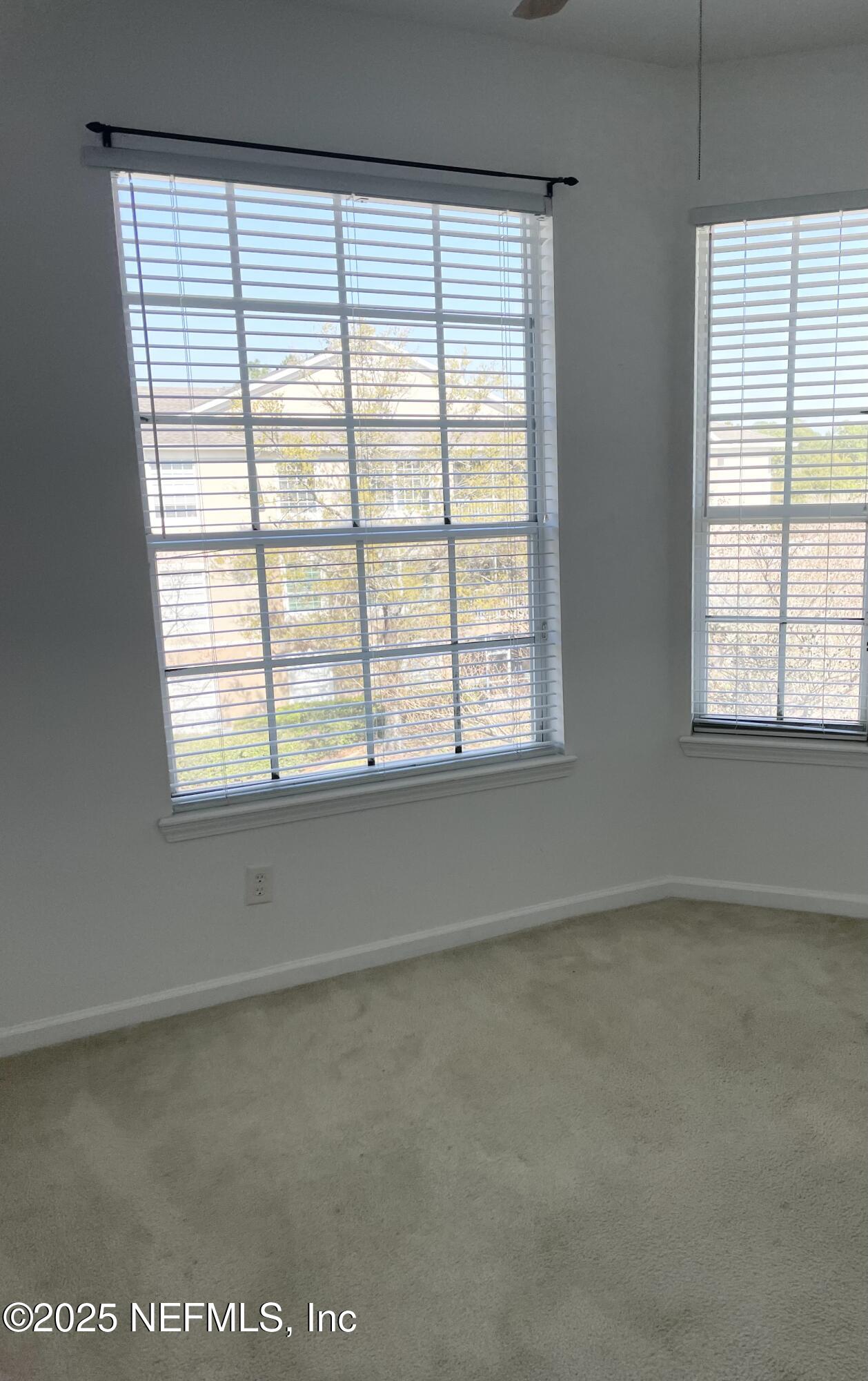 7990 Baymeadows Road East, Unit 426 Jacksonville, FL 32256 - Photo 11 of 19 an empty room with a window