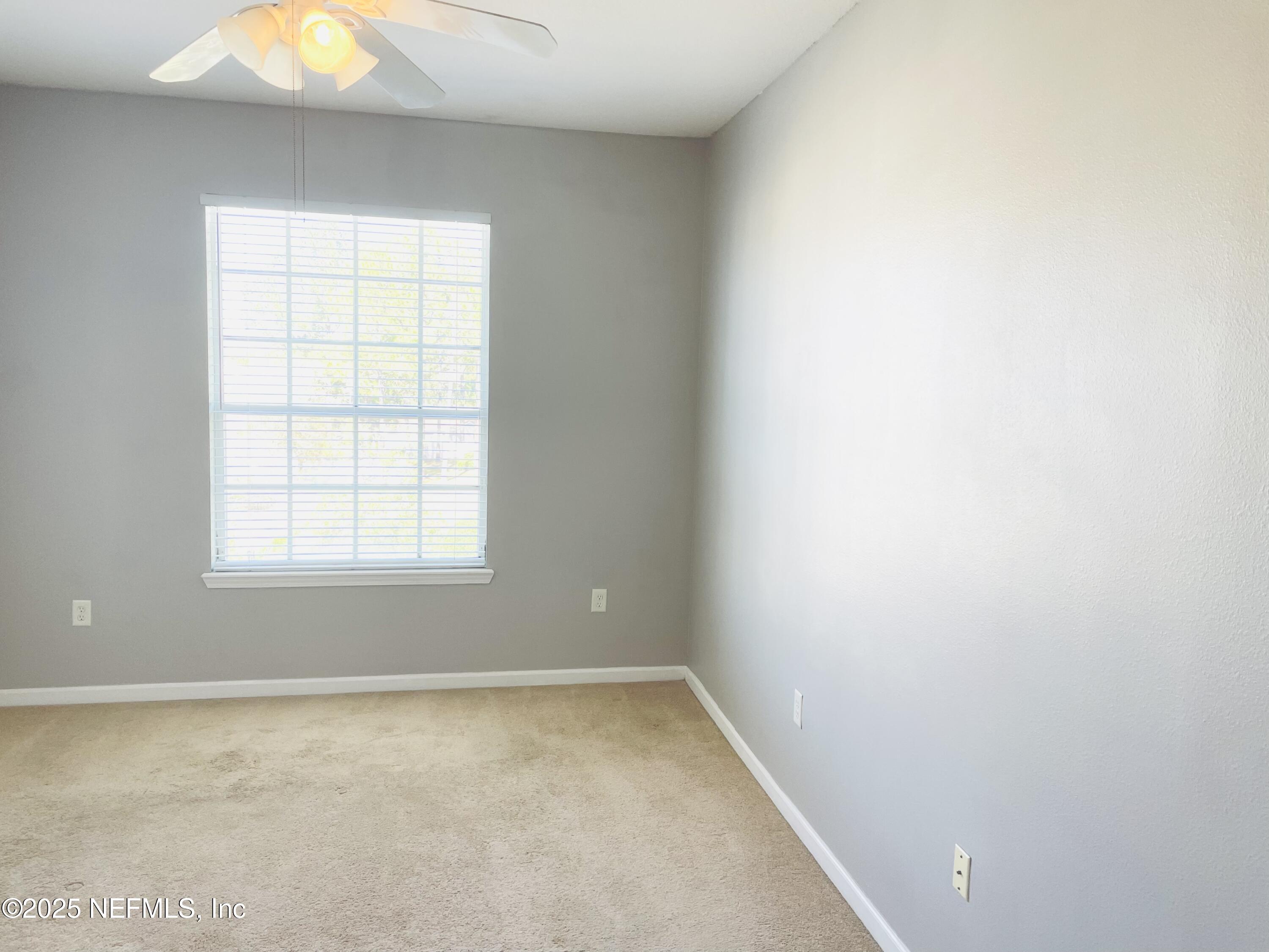 7990 Baymeadows Road East, Unit 426 Jacksonville, FL 32256 - Photo 12 of 19 an empty room with a window