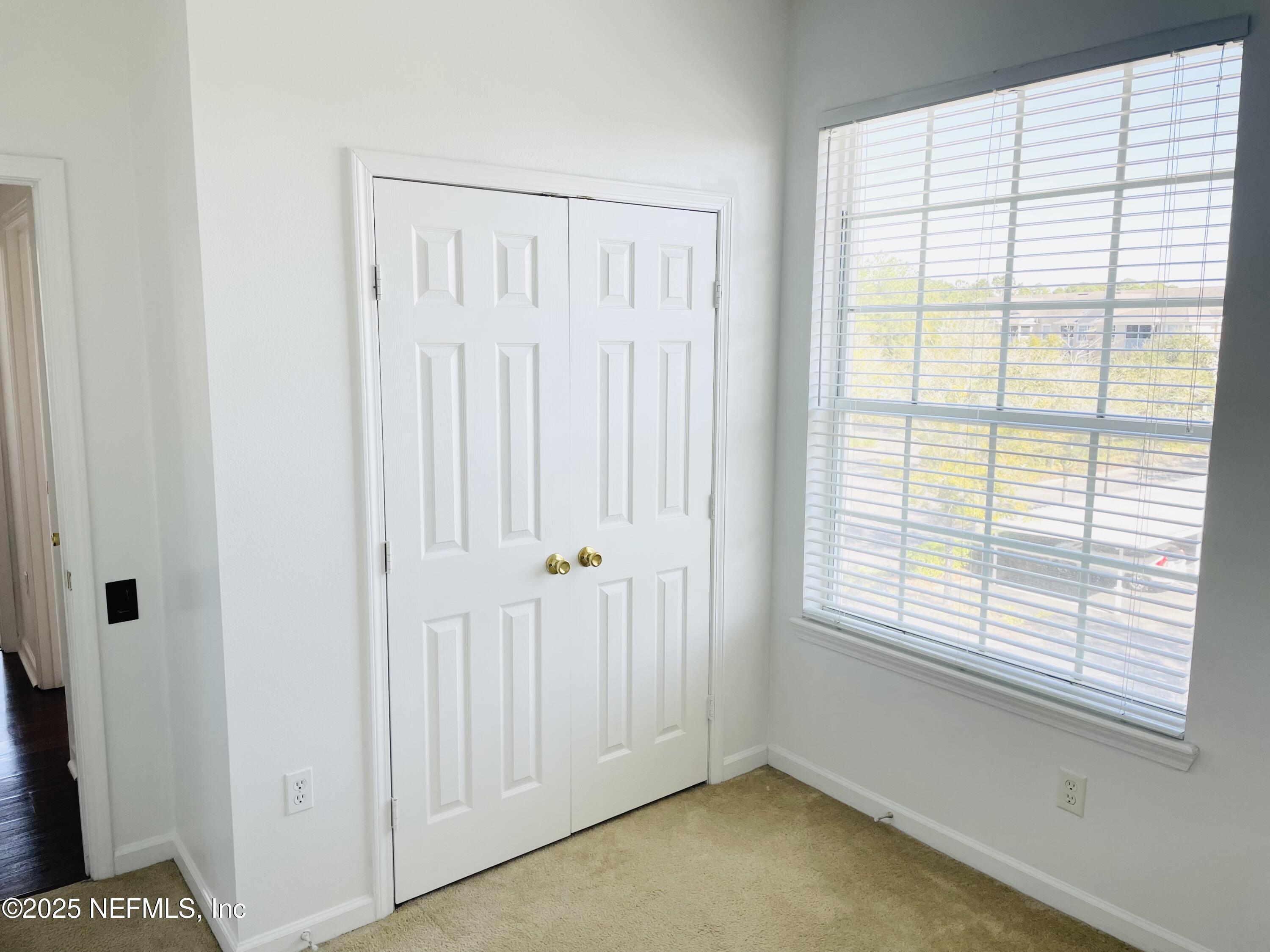 7990 Baymeadows Road East, Unit 426 Jacksonville, FL 32256 - Photo 14 of 19 a view of an empty room with a window
