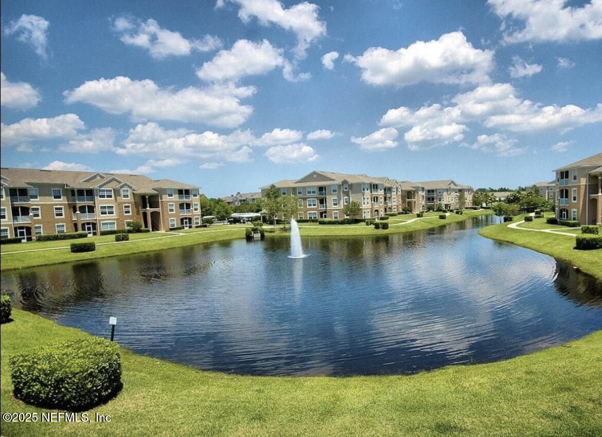 7990 Baymeadows Road East, Unit 426 Jacksonville, FL 32256 - Photo 18 of 19 a view of a lake with a house