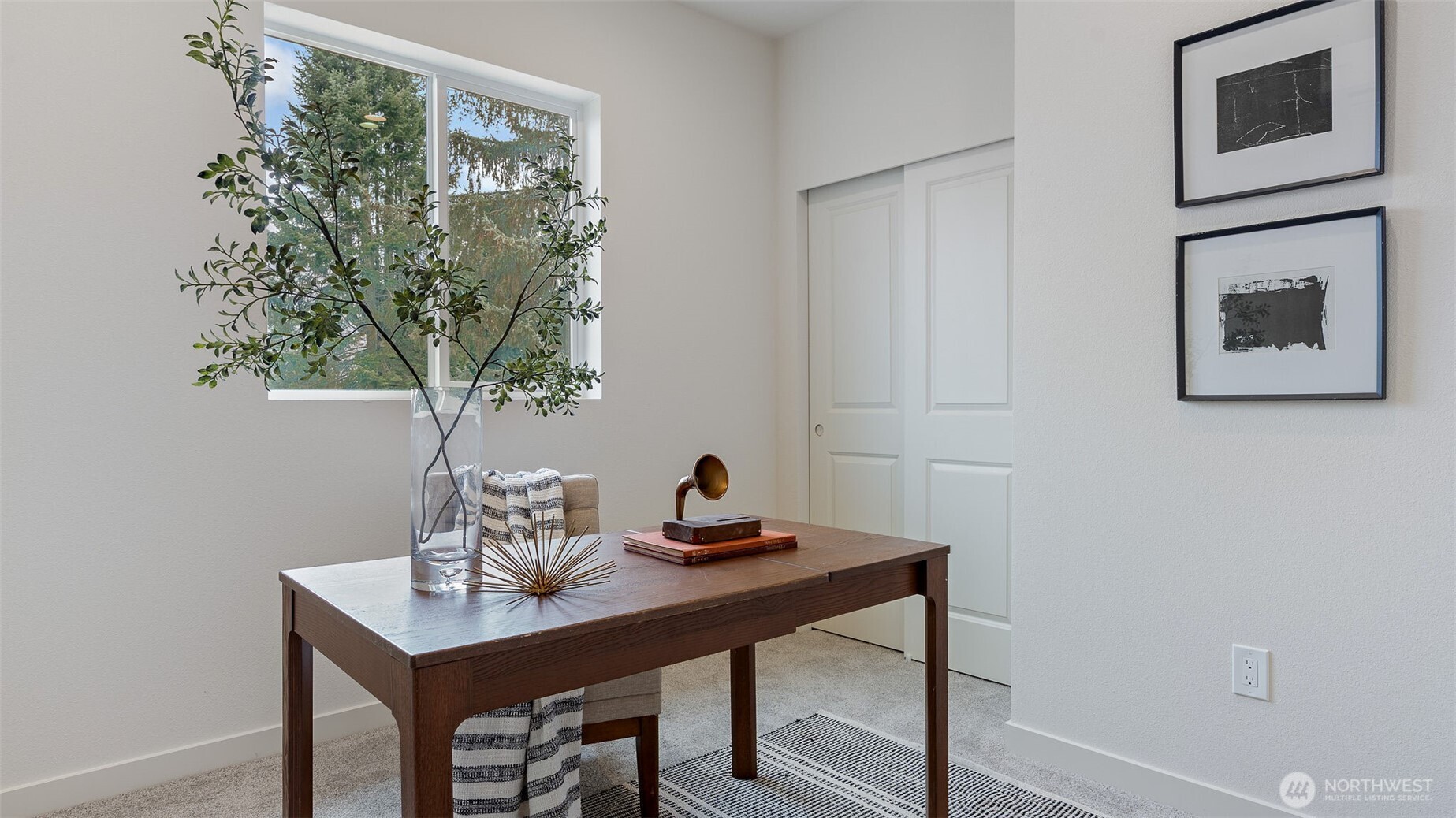 225 106th Street Southwest, Unit A2 Everett, WA 98204 - Photo 16 of 26 a view of a workspace with a table and chair in a room