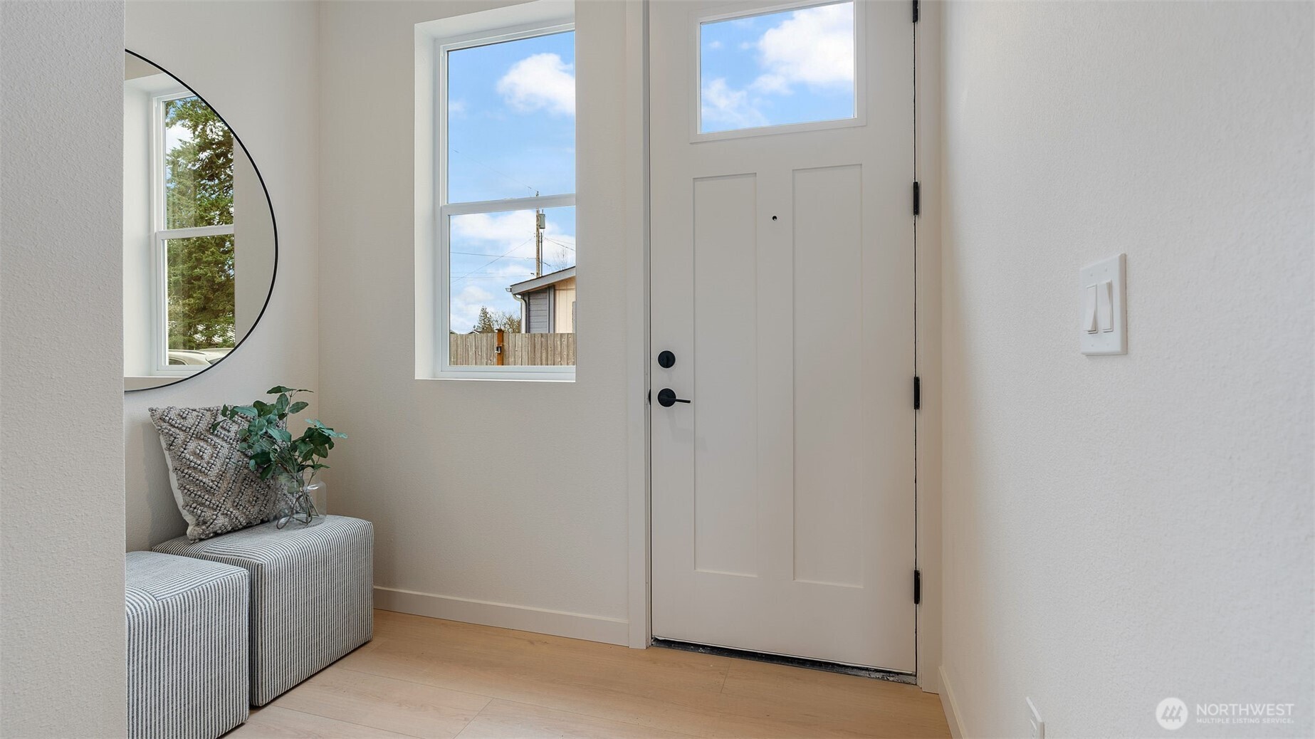 225 106th Street Southwest, Unit A2 Everett, WA 98204 - Photo 18 of 26 an entryway with wooden floor mirror and windows