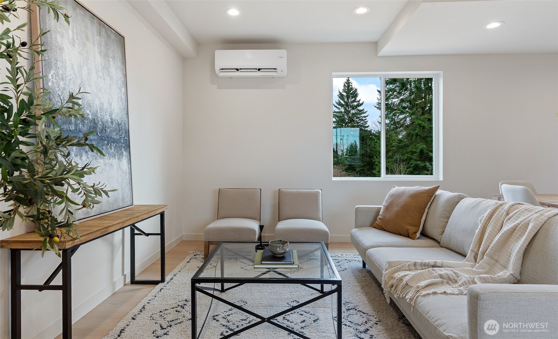 225 106th Street Southwest, Unit A2 Everett, WA 98204 - Photo 3 of 26 a living room with furniture and a potted plant