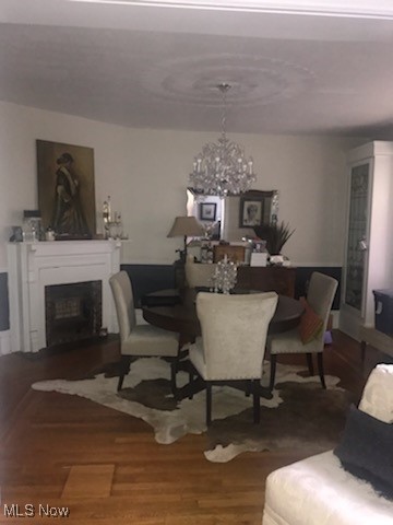 276 Merriman Road Akron, OH 44303 - Photo 8 of 24 Dining room featuring a chandelier, wood floor, lead crystal chandelier.