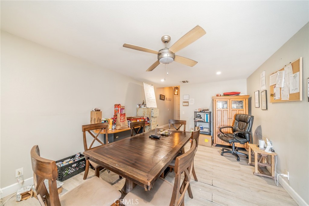 732 South Acacia Avenue Rialto, CA 92376 - Photo 11 of 30 a dining room with furniture and a chandelier