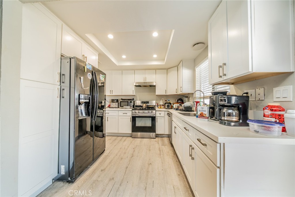 732 South Acacia Avenue Rialto, CA 92376 - Photo 12 of 30 a kitchen with cabinets and stainless steel appliances
