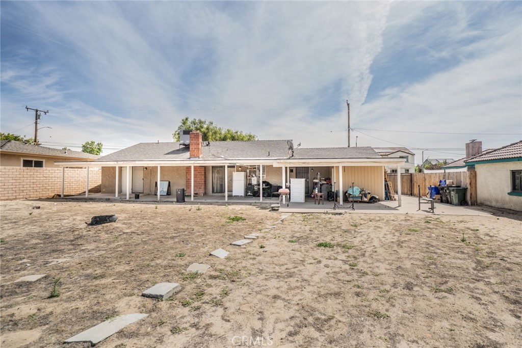 732 South Acacia Avenue Rialto, CA 92376 - Photo 15 of 30 a view of a house with a yard