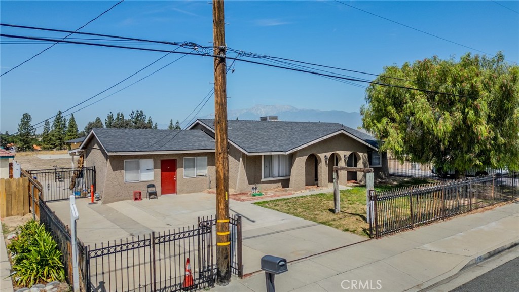 732 South Acacia Avenue Rialto, CA 92376 - Photo 25 of 30 a view of a house with wooden fence