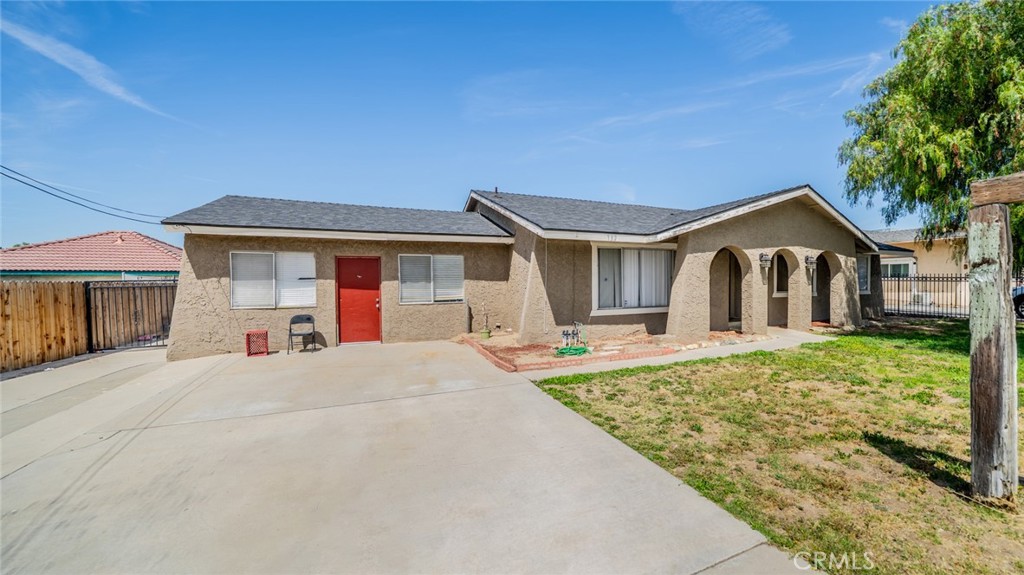 732 South Acacia Avenue Rialto, CA 92376 - Photo 3 of 30 a front view of a house with a yard and porch