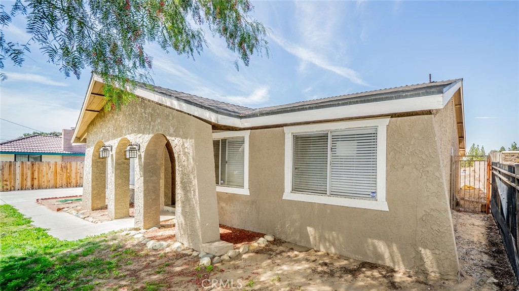 732 South Acacia Avenue Rialto, CA 92376 - Photo 4 of 30 a front view of a house with a yard