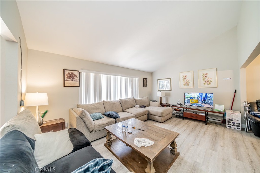 732 South Acacia Avenue Rialto, CA 92376 - Photo 5 of 30 a living room with furniture and a wooden floor