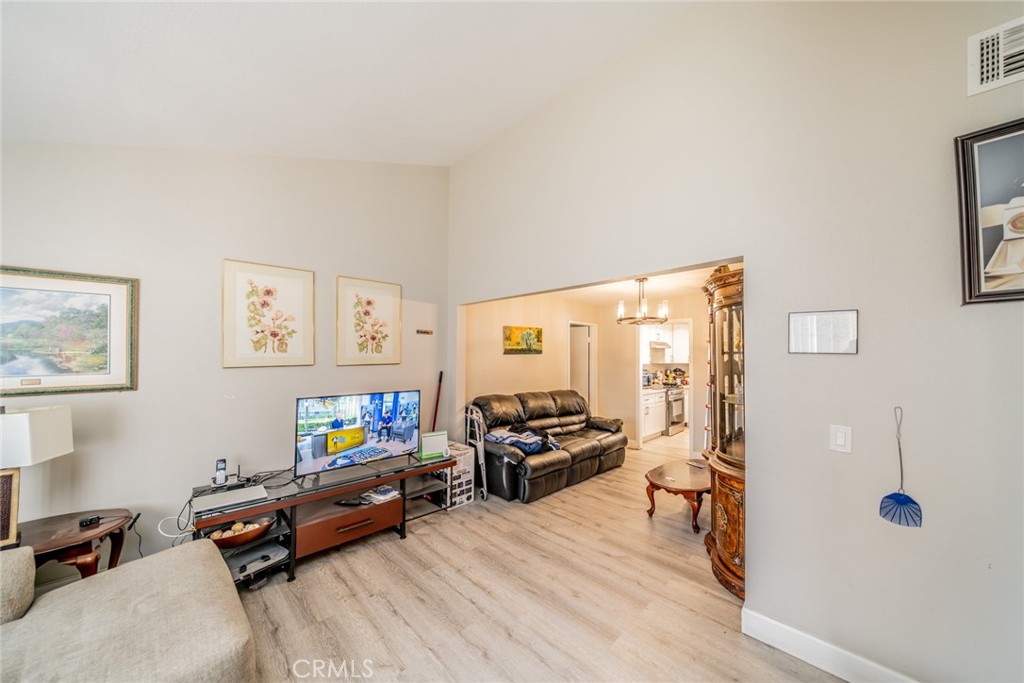 732 South Acacia Avenue Rialto, CA 92376 - Photo 7 of 30 a living room with furniture flat screen tv and a window
