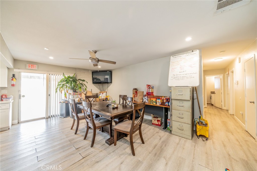 732 South Acacia Avenue Rialto, CA 92376 - Photo 10 of 30 a view of a dining room with furniture and wooden floor