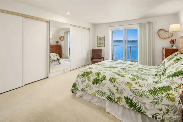 a spacious bedroom with a bed and a dresser