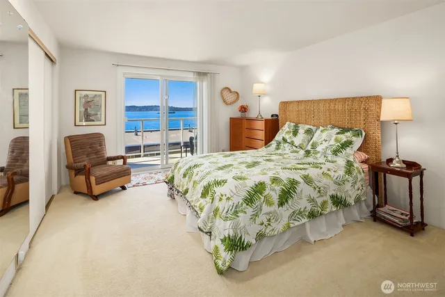 a spacious bedroom with a bed and a couch