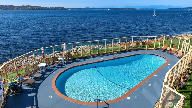 a view of swimming pool from a balcony
