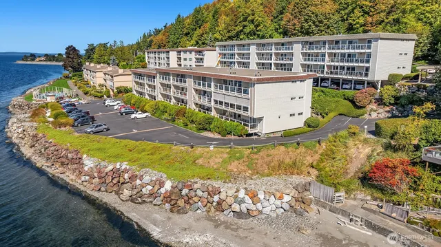 a view of balcony with wooden floor and seating space
