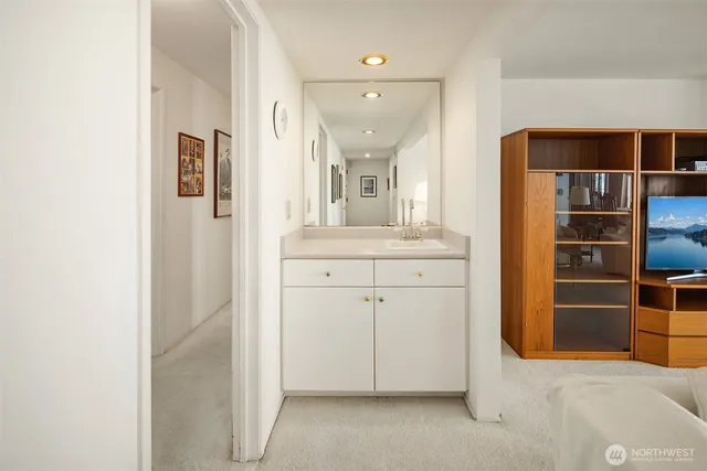 a bathroom with a sink and a mirror